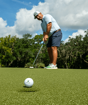 Man putting on SYNLawn artificial turf