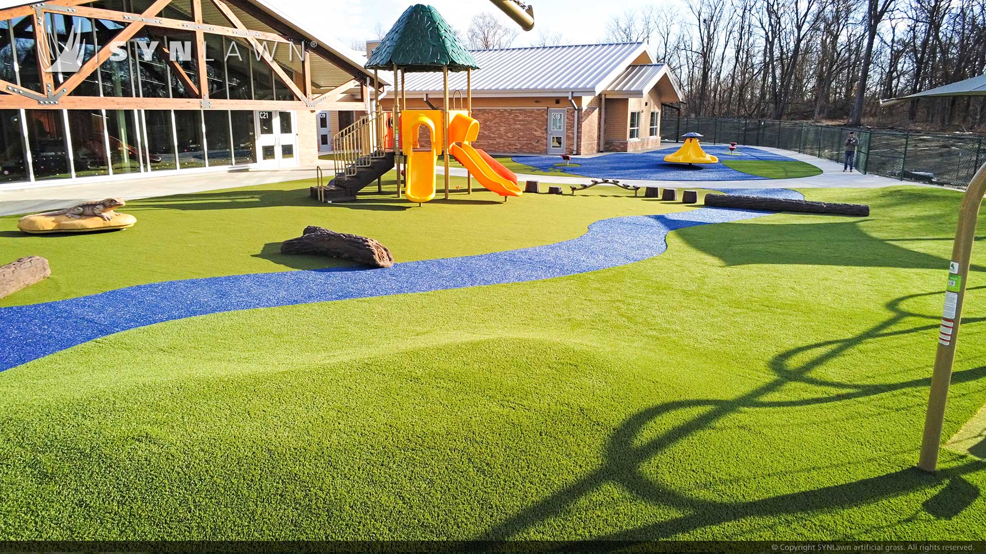 image of synlawn artificial grass at liggett trails early education center featuring colored artificial turf