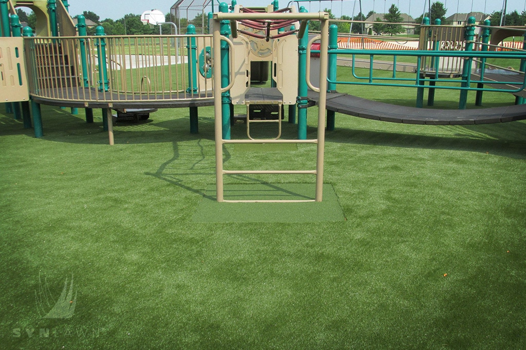 image of kansas city monkey bars with safe play artificial grass
