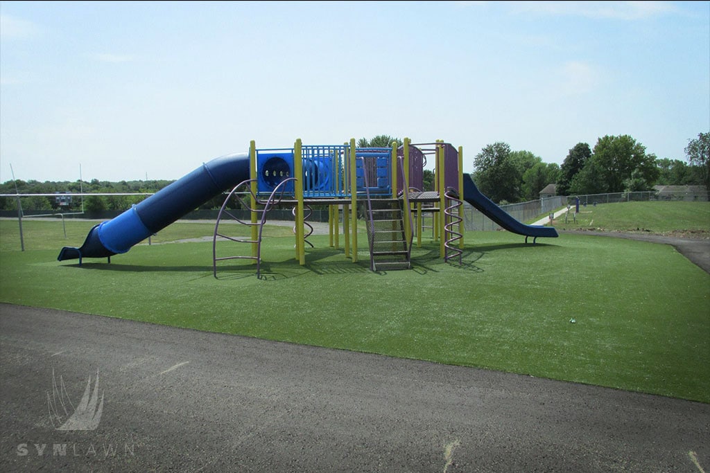 image of john nowlin elementary playground with a blue slide