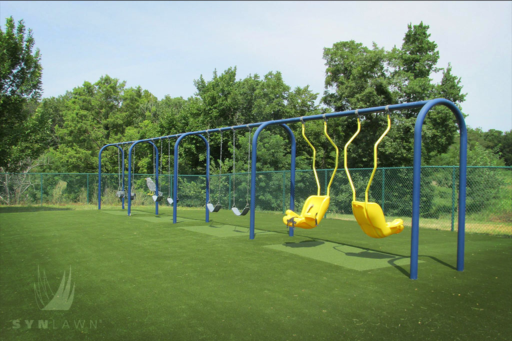 image of liggett trail education center with a yellow and blue swing set