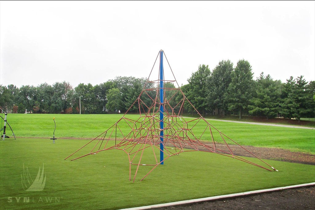 image of lee’s summit playground climbing equipment on artificial grass