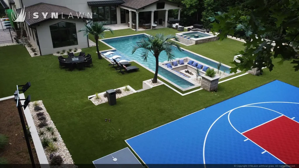 image of SYNLawn artificial grass at Bella Fine Custom Homes with pool surround and SYNCourt basketball court Georgia