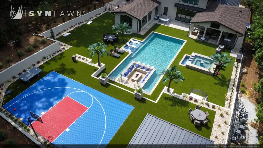 image of SYNLawn artificial grass at Bella Fine Custom Homes with pool surround and SYNCourt basketball court Georgia