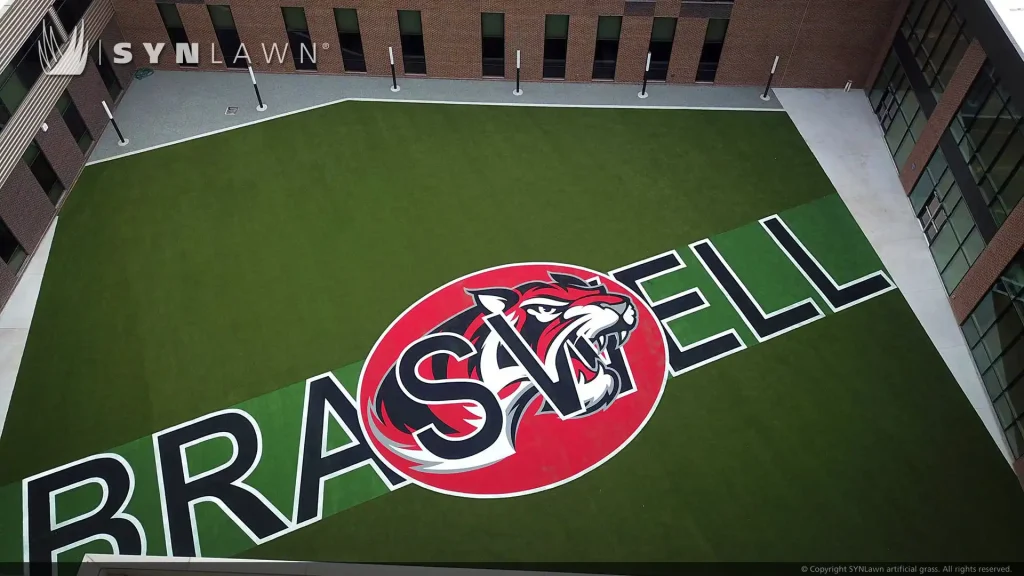 image of SYNLawn artificial grass at Ray Braswell High School Custom Inlaid Logo and Practice Field for Recreation and Multi-Use