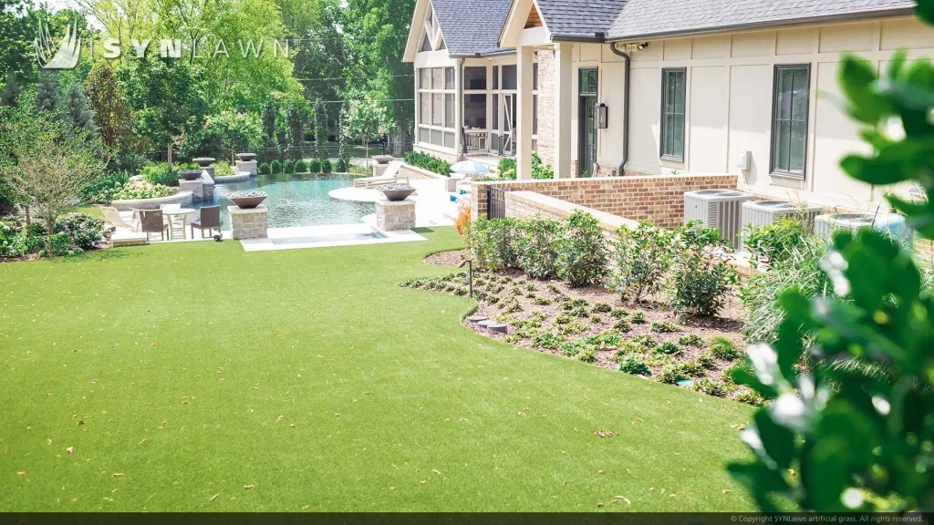image of SYNLawn artificial grass backyard putting green pool surround and bocce court at Tennessee residential home