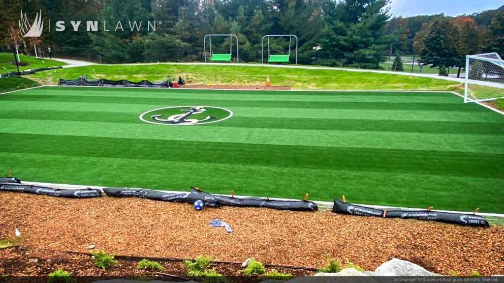 image of Custom made logo using SYNLawn artificial grass at the Glen Lake Schools Practice Field in Maple City Michigan