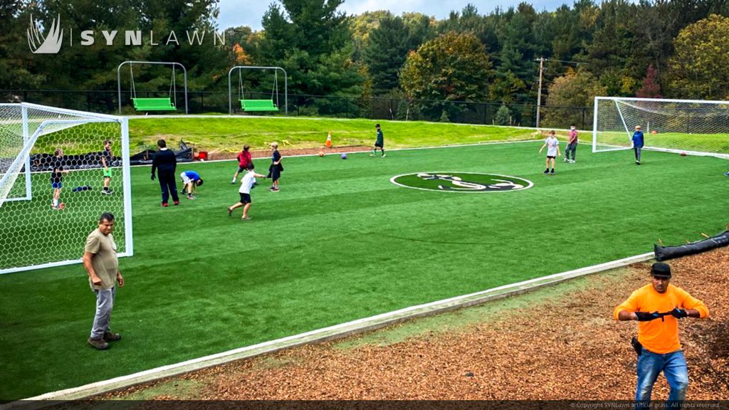 image of Custom made logo using SYNLawn artificial grass at the Glen Lake Schools Practice Field in Maple City Michigan