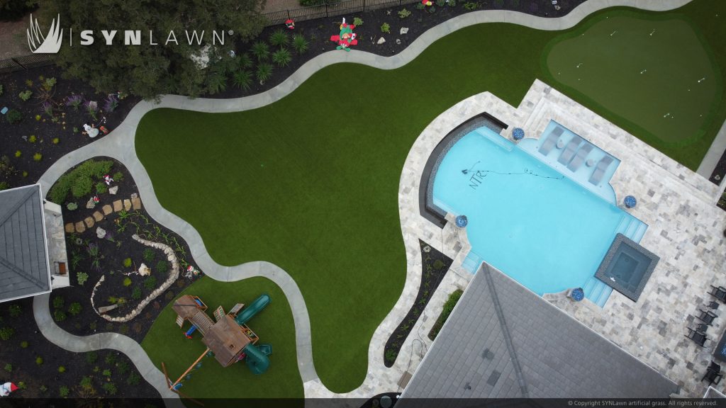 image of artificial grass backyard with golf putting green kid play area and pool surround in San Francisco Bay Area California