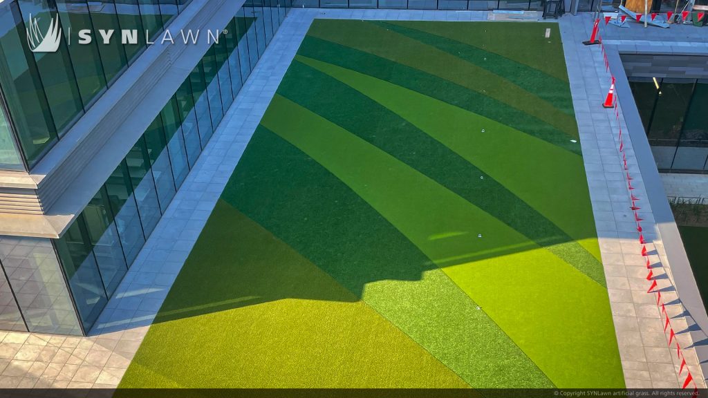 image of synlawn artificial grass custom inlaid turf design roof top at hewlett packard campus offices in Houston Texas