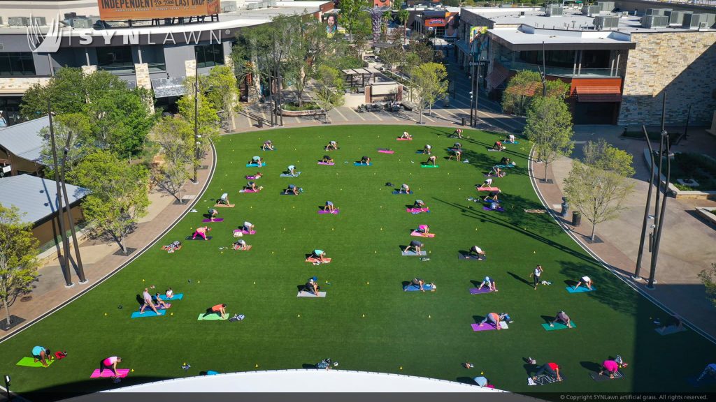 image of SYNLawn artificial grass at The Colony Grandscape Dallas Texas Retail Shopping Center Event Lawn for outdoor entertainment space