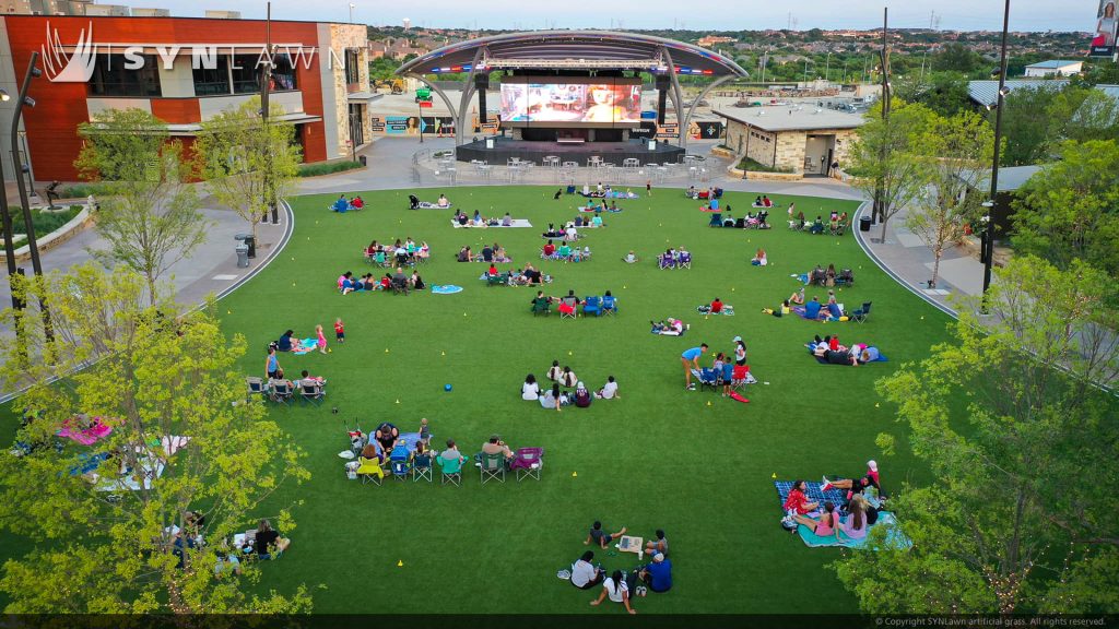 image of SYNLawn artificial grass at The Colony Grandscape Dallas Texas Retail Shopping Center Event Lawn for outdoor entertainment space