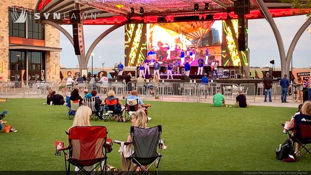 image of SYNLawn artificial grass at The Colony Grandscape Dallas Texas Retail Shopping Center Event Lawn for outdoor entertainment space