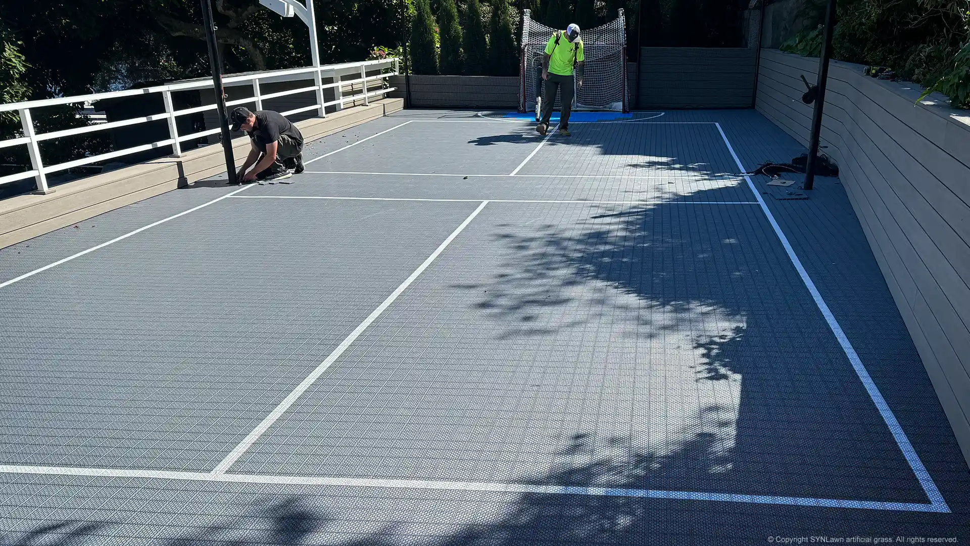 image of syncourt sport tile court system by synlawn being installed in Seattle Washington
