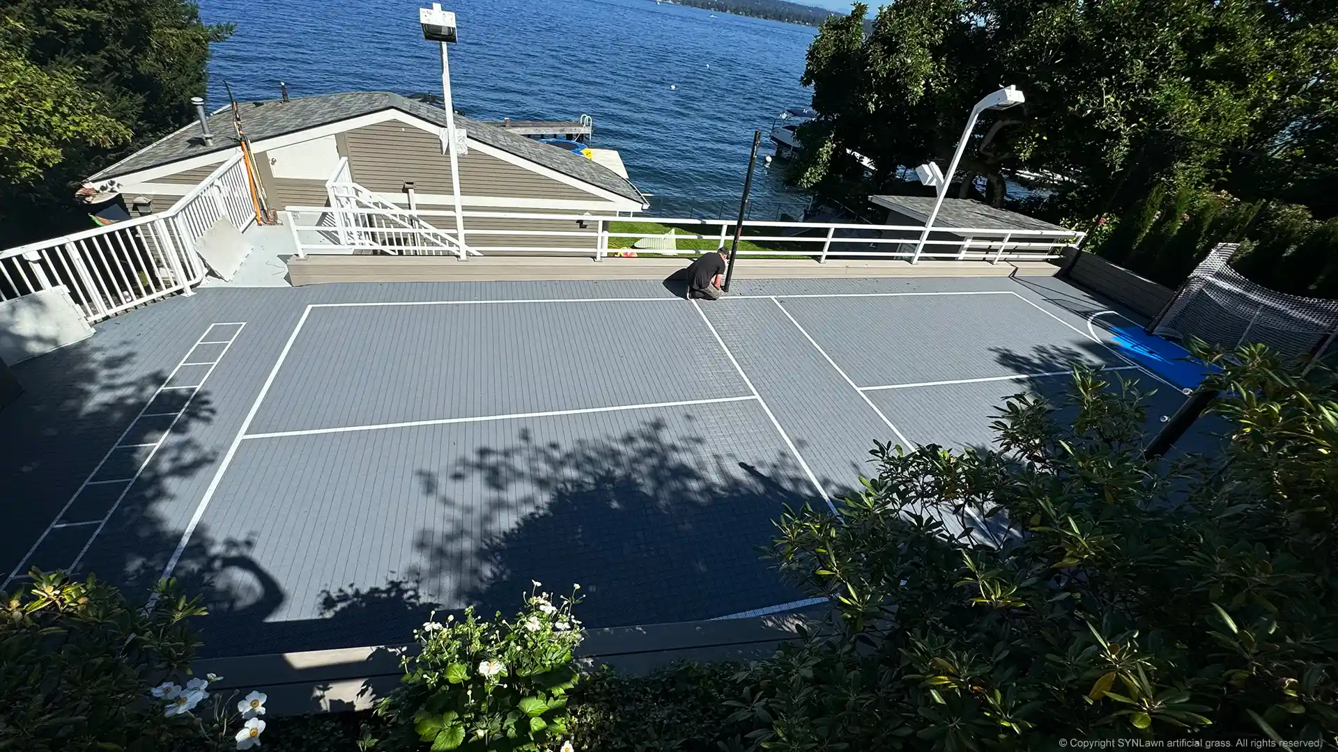 image of syncourt sport tile court system by synlawn being installed in Seattle Washington