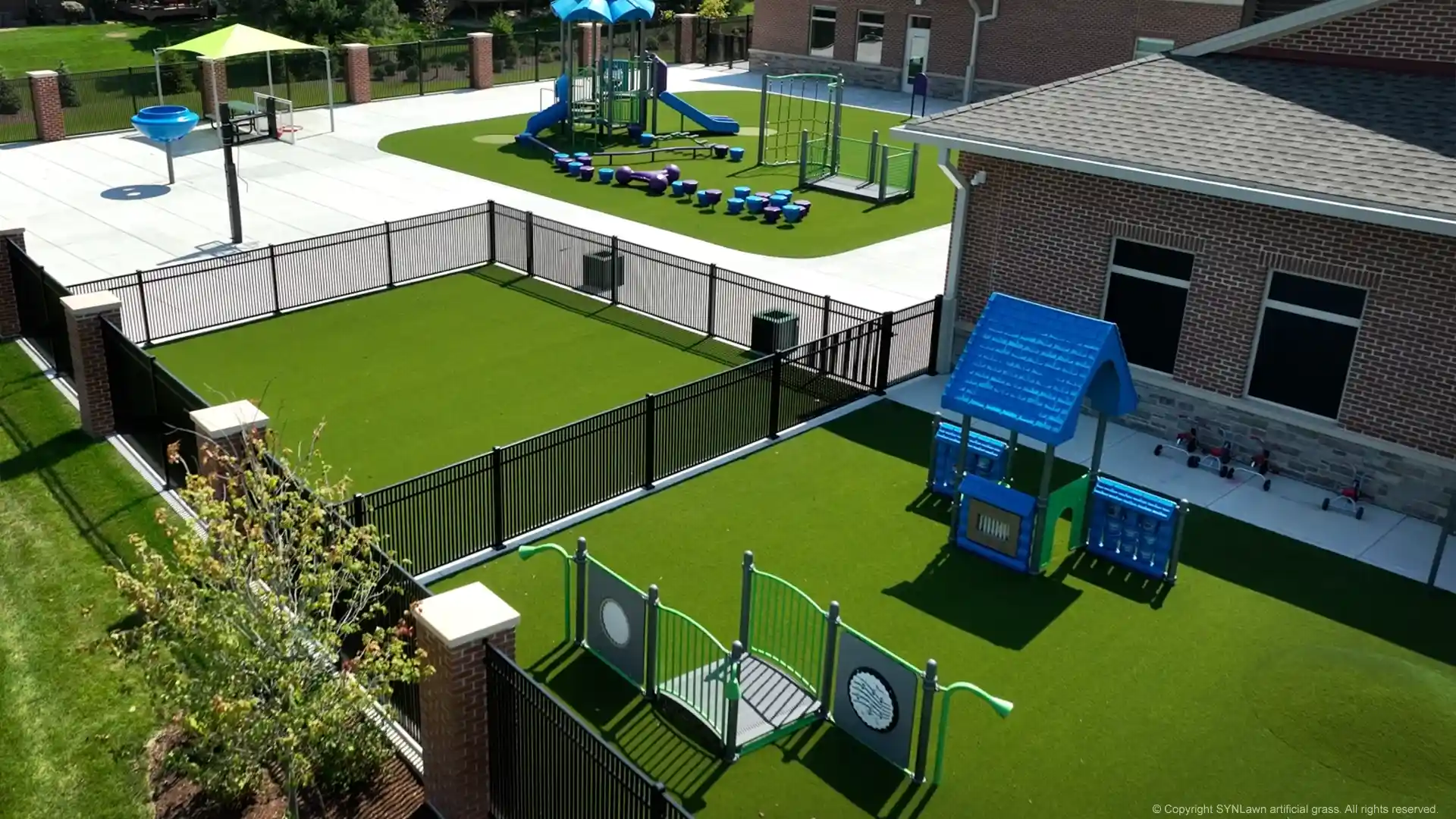 Child-safe playground turf installed by SYNLawn Chicago at the Everbrook Academy image of synlawn artificial playground grass at everbrook academy in chicago illinois