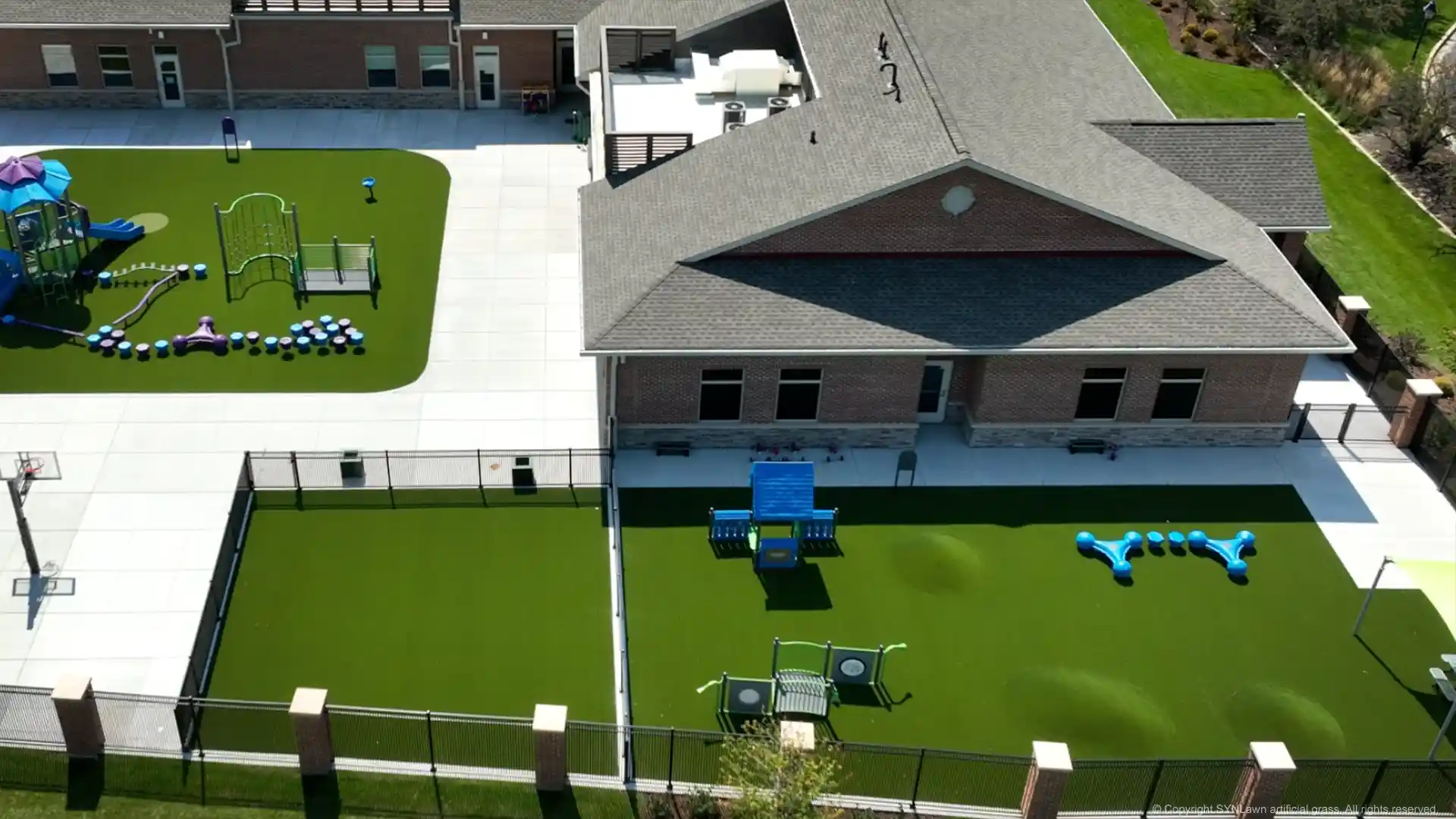 Child-safe playground turf installed by SYNLawn Chicago at the Everbrook Academy image of synlawn artificial playground grass at everbrook academy in chicago illinois
