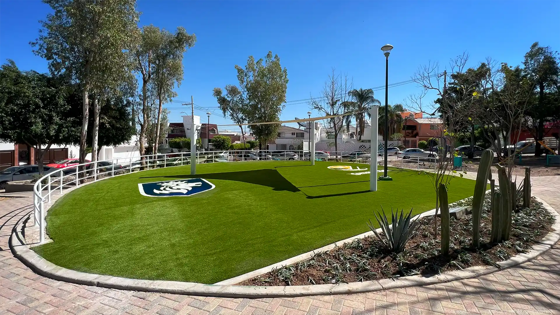 Community green space in Aldama, Guanajuato, México featuring child safe playground turf image of child safe artificial grass with custom logo in aldama guanajuato méxico