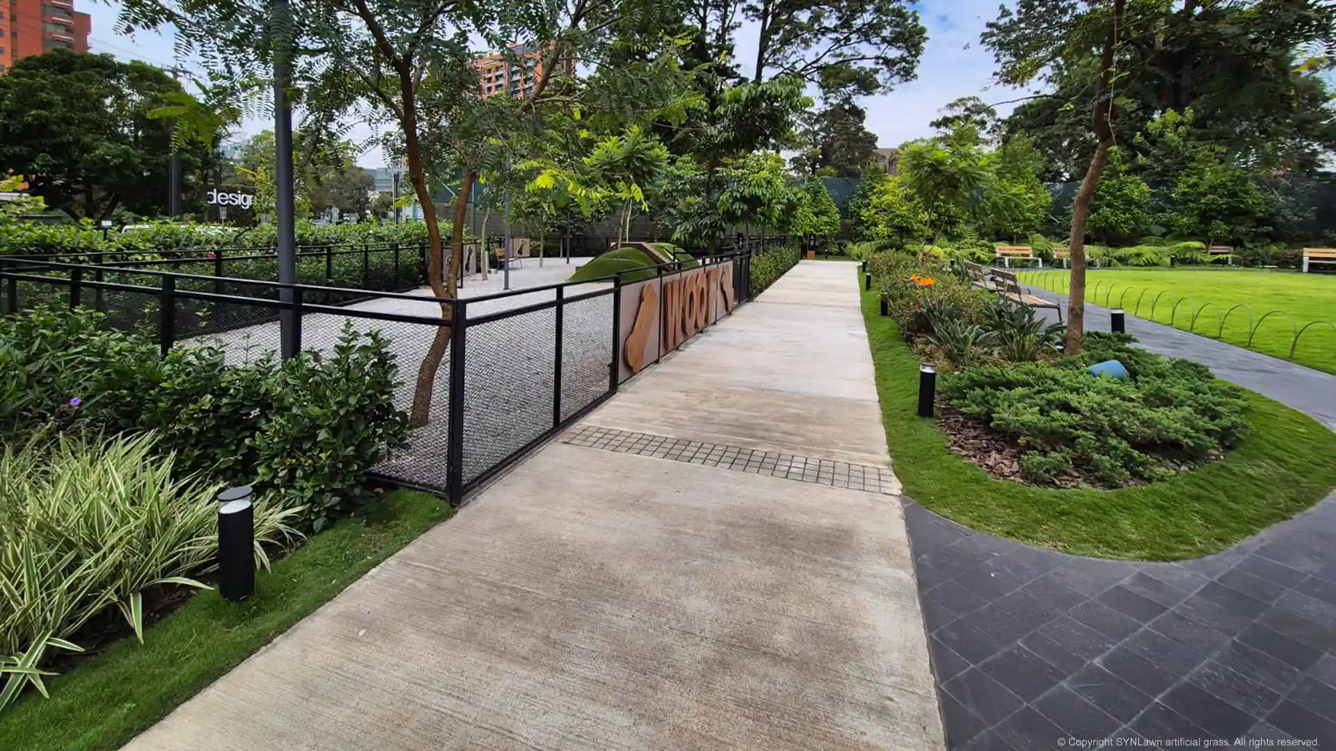 SYNLawn Pet Turf is used to create a mound for dog and pet agility at Guatemala City pet park Latin America image of mounded hill with tunnels at oakland place dog park in guatemala city